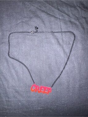 Spencer's Red 'CREEP' Pendant Necklace with Black Chain